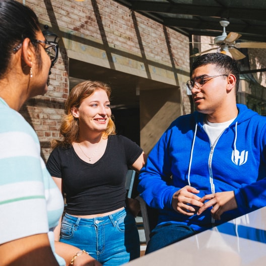 Students talking in cafe